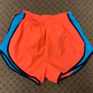 Nike women’s athletic dry fit tempo running shorts size medium neon Orange